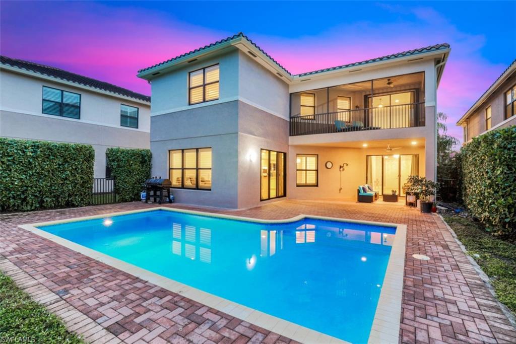 3082 Hudson Terrace Naples, FL 34119 - Photo 2 of 35 a front view of house with yard and swimming pool