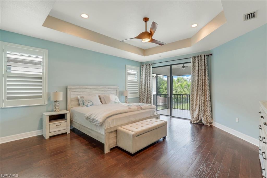 3082 Hudson Terrace Naples, FL 34119 - Photo 21 of 35 a spacious bedroom with a large bed and a large window