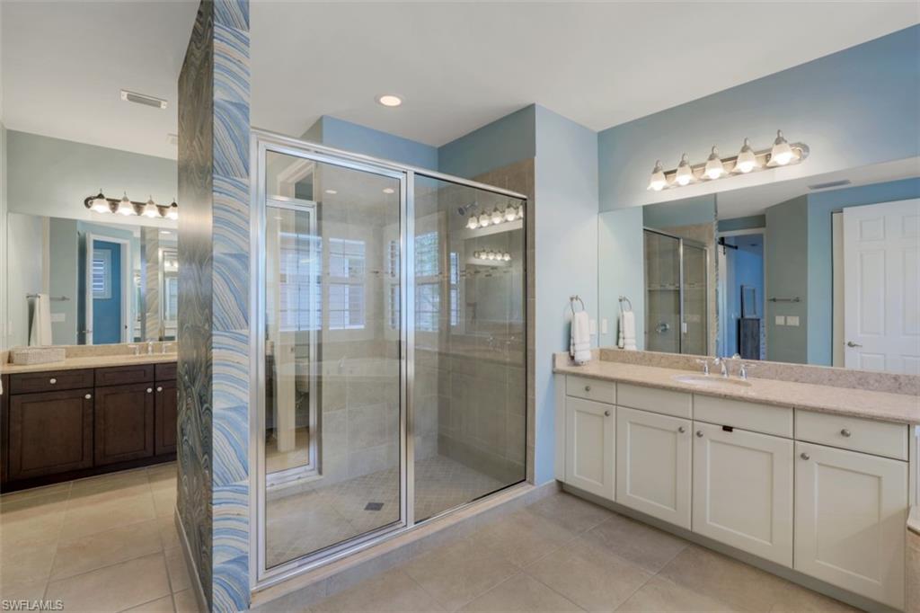 3082 Hudson Terrace Naples, FL 34119 - Photo 26 of 35 a bathroom with a double vanity sink and a mirror