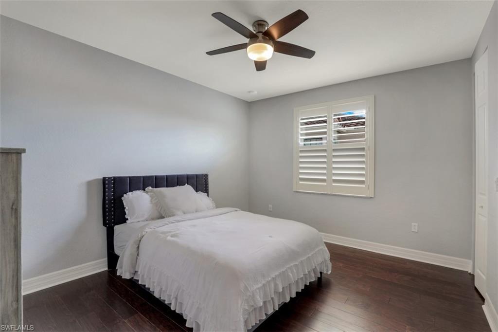 3082 Hudson Terrace Naples, FL 34119 - Photo 29 of 35 a bedroom with a bed and a window