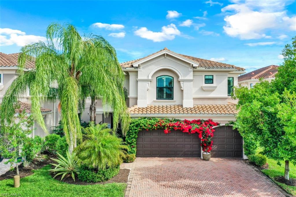 3082 Hudson Terrace Naples, FL 34119 - Photo 4 of 35 a front view of a house with a yard