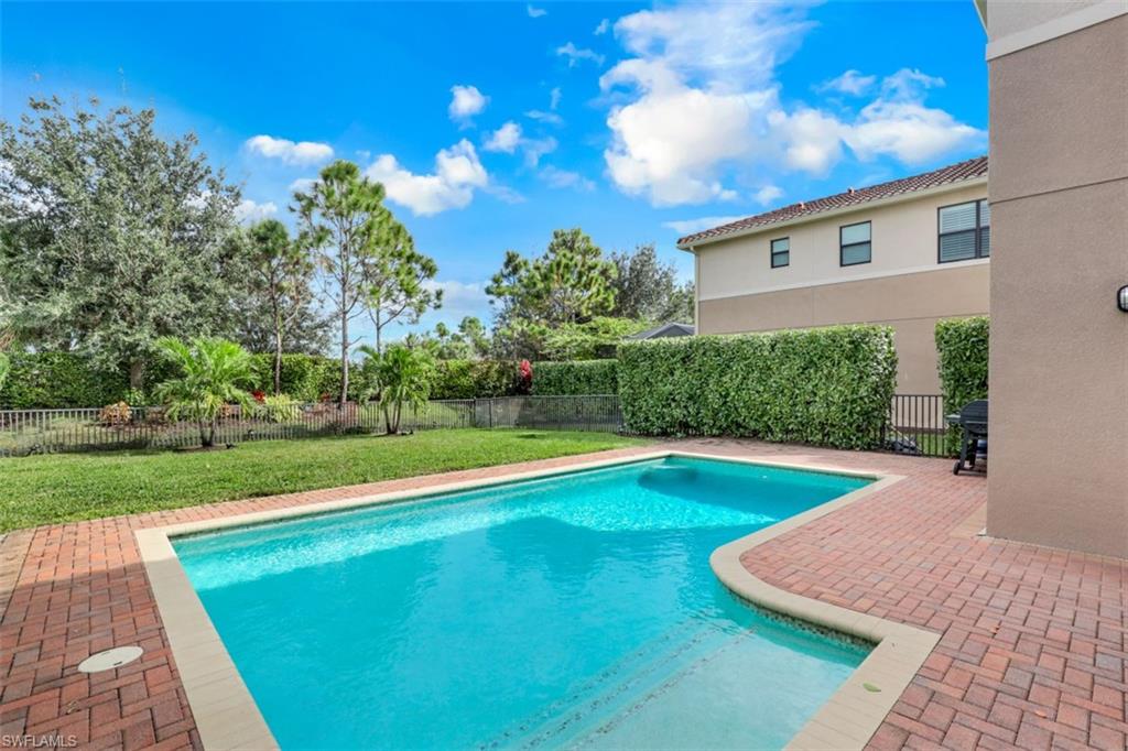 3082 Hudson Terrace Naples, FL 34119 - Photo 5 of 35 a view of a backyard with a swimming pool