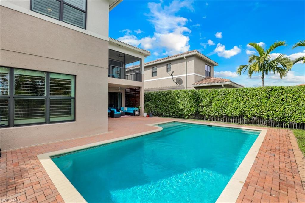 3082 Hudson Terrace Naples, FL 34119 - Photo 6 of 35 a front view of a house with a yard and potted plants