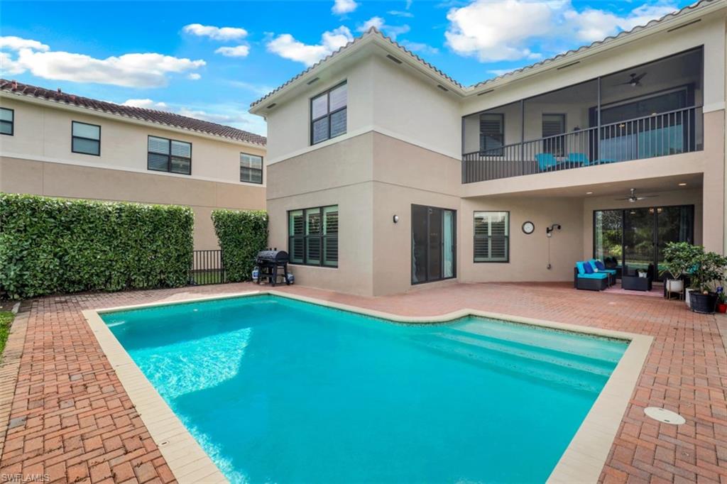 3082 Hudson Terrace Naples, FL 34119 - Photo 8 of 35 a view of a house with pool and a yard