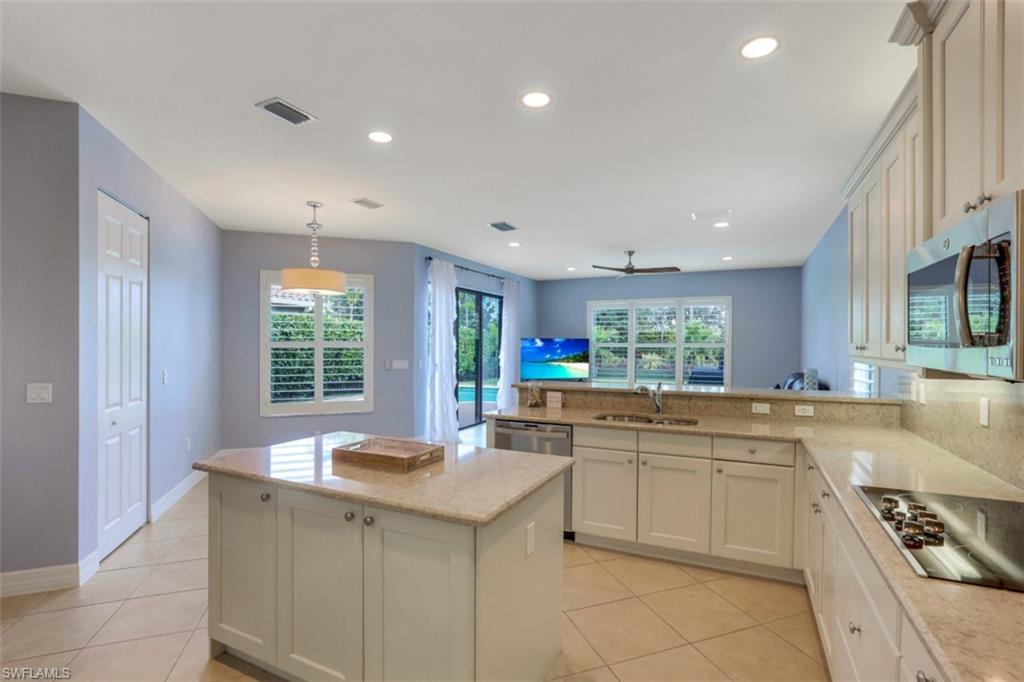 3082 Hudson Terrace Naples, FL 34119 - Photo 10 of 35 a kitchen with sink cabinets and window