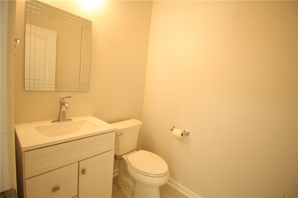 3343 Mill Grove Terrace Dacula, GA 30019 - Photo 11 of 28 a bathroom with a sink a toilet and vanity