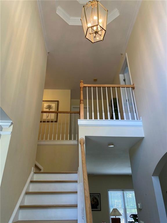 3343 Mill Grove Terrace Dacula, GA 30019 - Photo 12 of 28 a view of staircase with railing and white walls