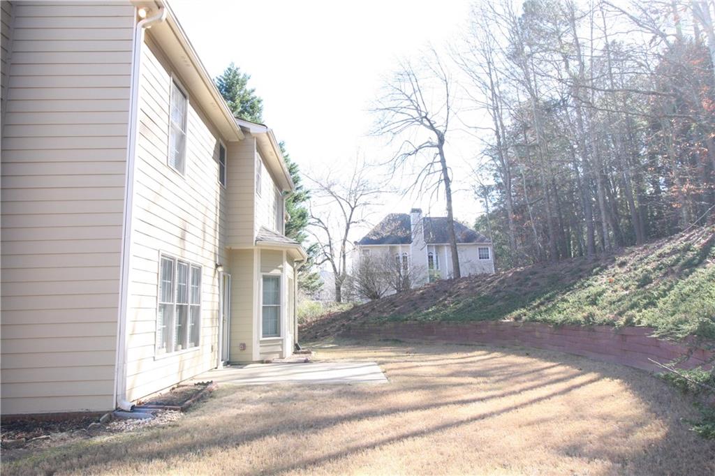3343 Mill Grove Terrace Dacula, GA 30019 - Photo 21 of 28 a view of a house with a yard