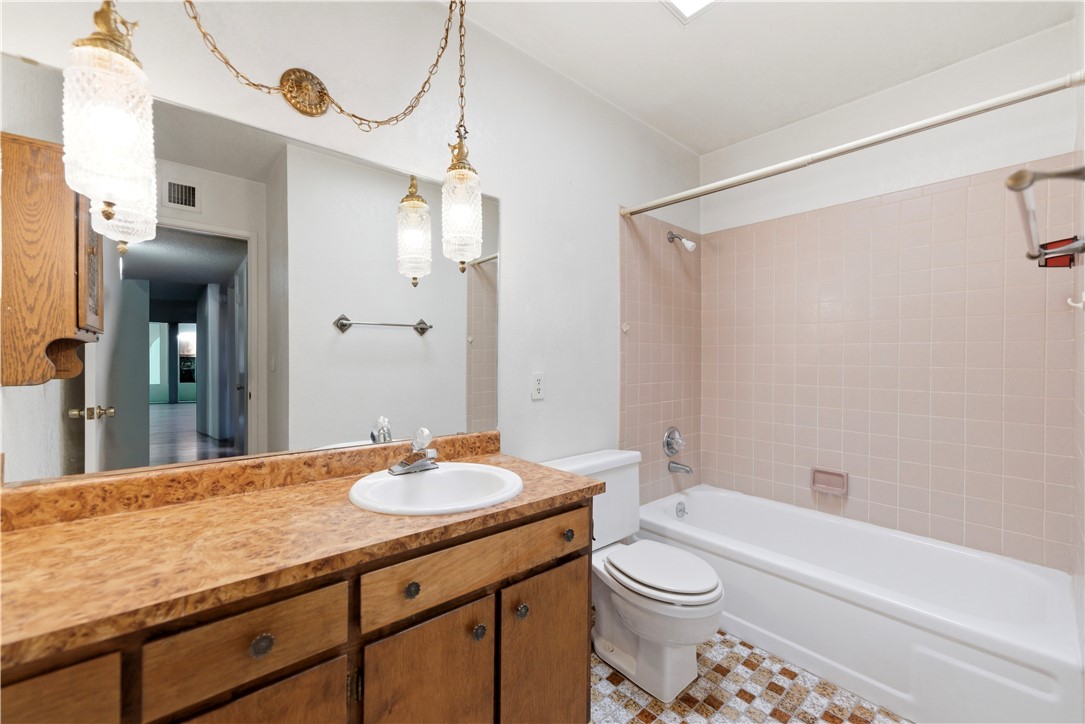 590 Ridgecrest Drive Kingman, AZ 86409 - Photo 17 of 33 a bathroom with a granite countertop sink toilet and shower