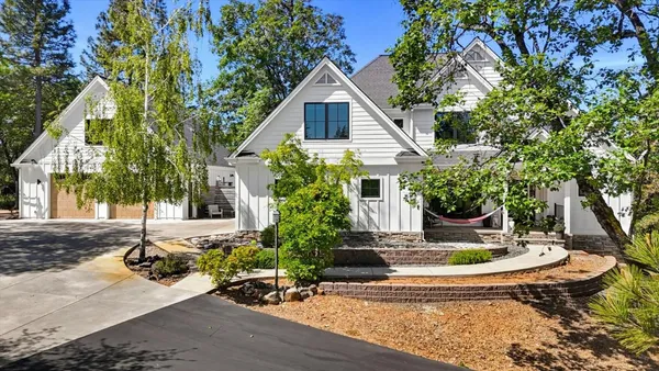 a front view of a house with garden