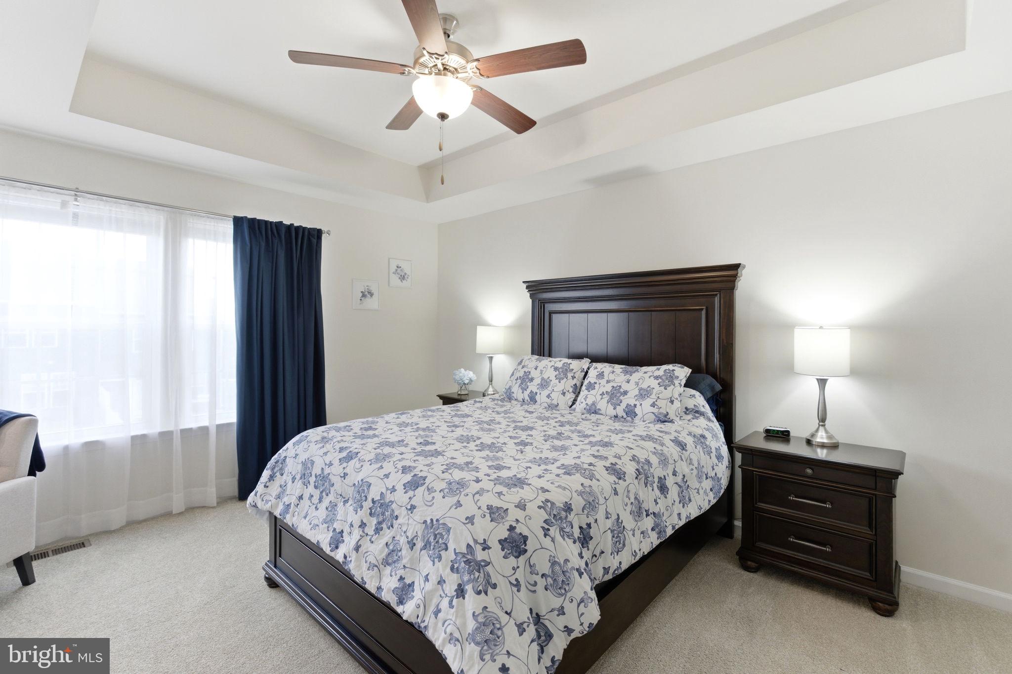 36 Tuxford Road Falling Waters, WV 25419 - Photo 15 of 33 Serene bedroom with elegant decor.