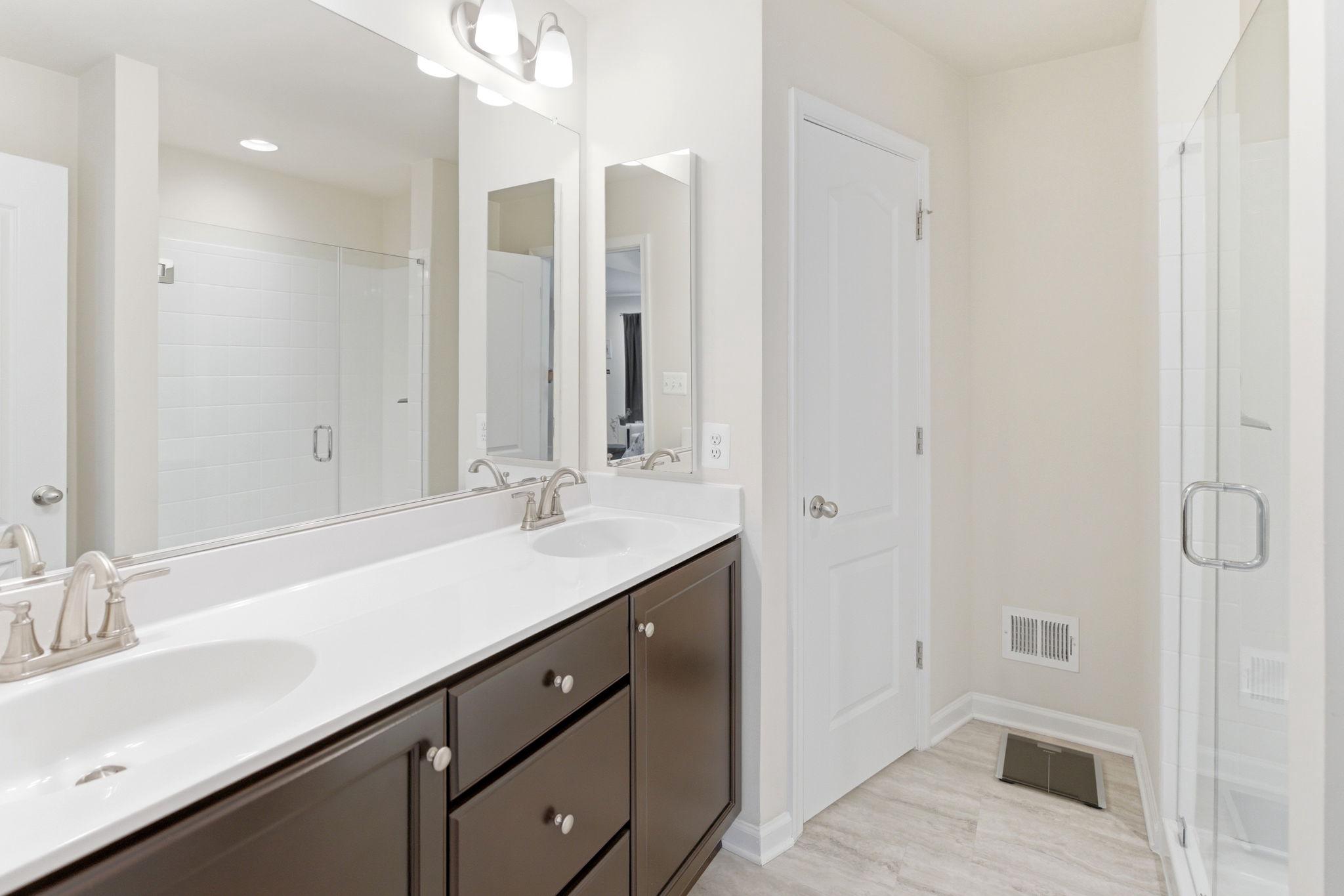 36 Tuxford Road Falling Waters, WV 25419 - Photo 16 of 33 Sleek modern primary bathroom w/ dual sink vanity.