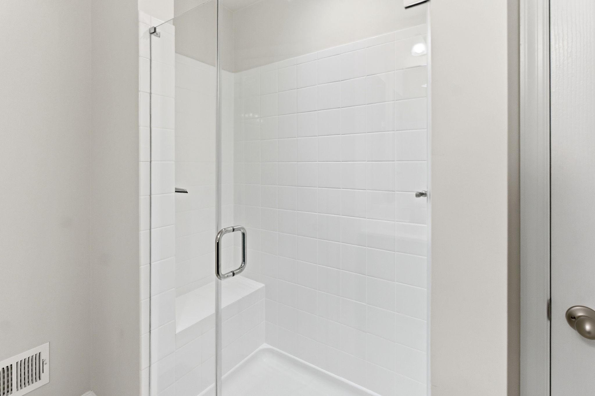36 Tuxford Road Falling Waters, WV 25419 - Photo 17 of 33 Large glass door & tile shower enclosure w/ bench.