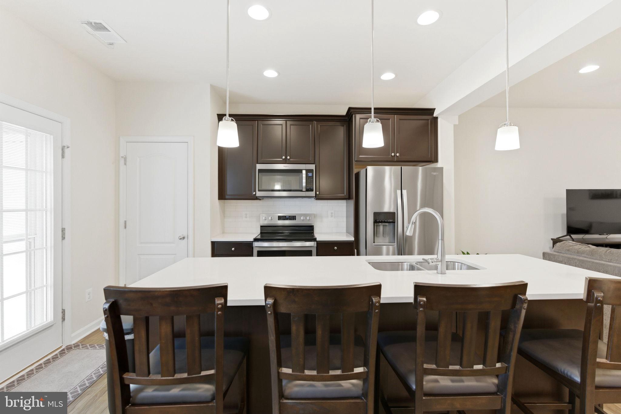 36 Tuxford Road Falling Waters, WV 25419 - Photo 9 of 33 Modern kitchen with sleek finishes.