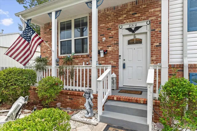 front view of a house with a small yard