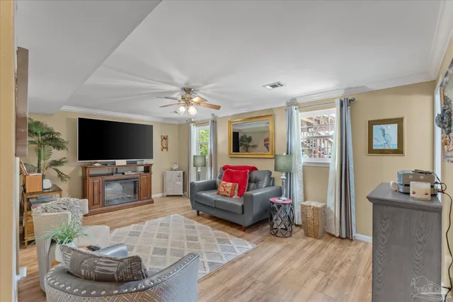 a view of a house with backyard sitting area and garden