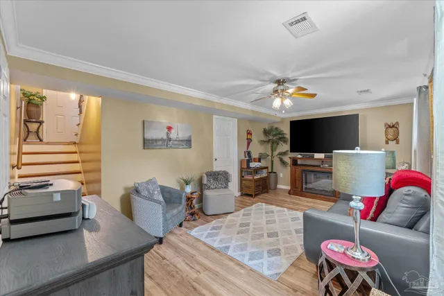 a living room with furniture and a fireplace