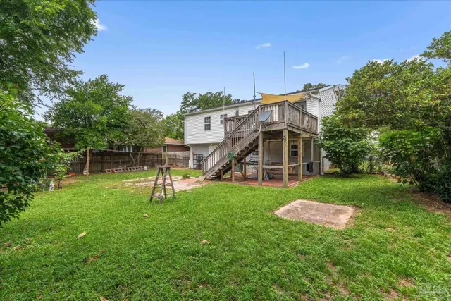 a view of backyard with small cabin