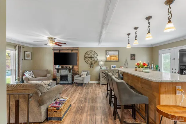 a living room with furniture and a flat screen tv