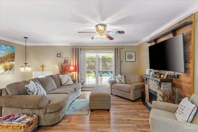 a living room with furniture and a flat screen tv