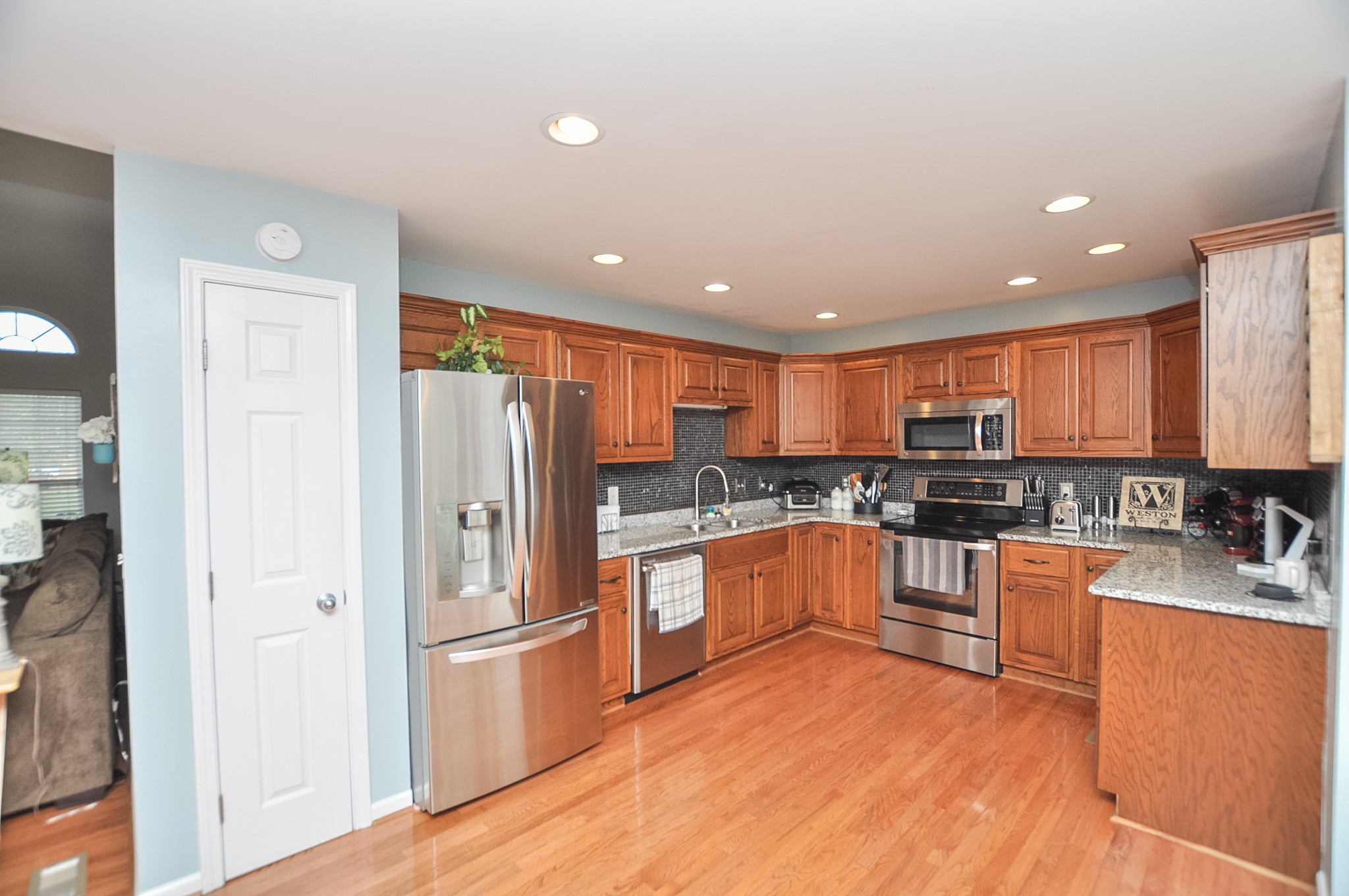 596 Windy Road Mount Juliet, TN 37122 - Photo 16 of 34 a kitchen with stainless steel appliances granite countertop a refrigerator and a stove top oven