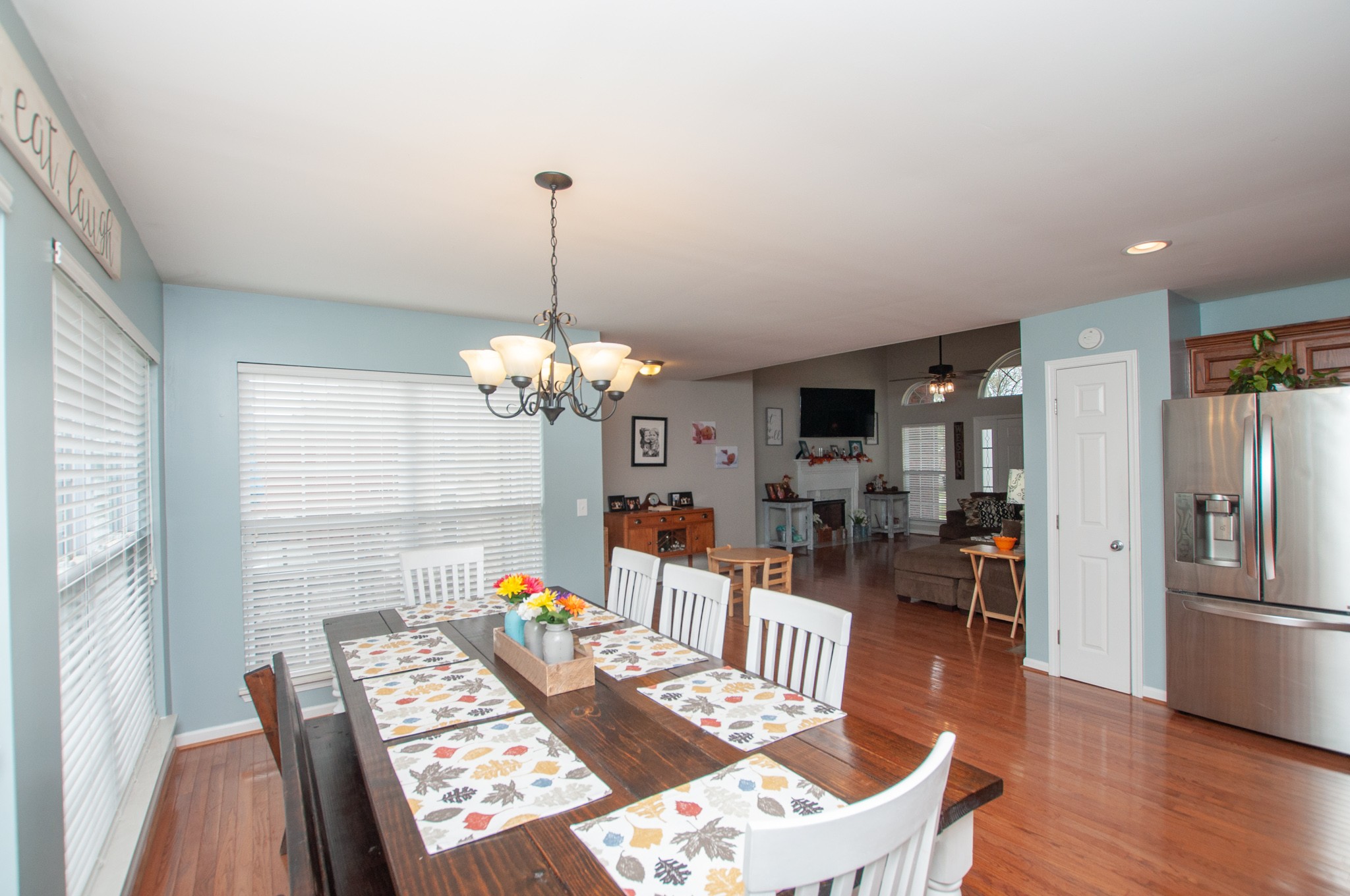 596 Windy Road Mount Juliet, TN 37122 - Photo 17 of 34 a living room with dining table furniture a dining table and a chandelier
