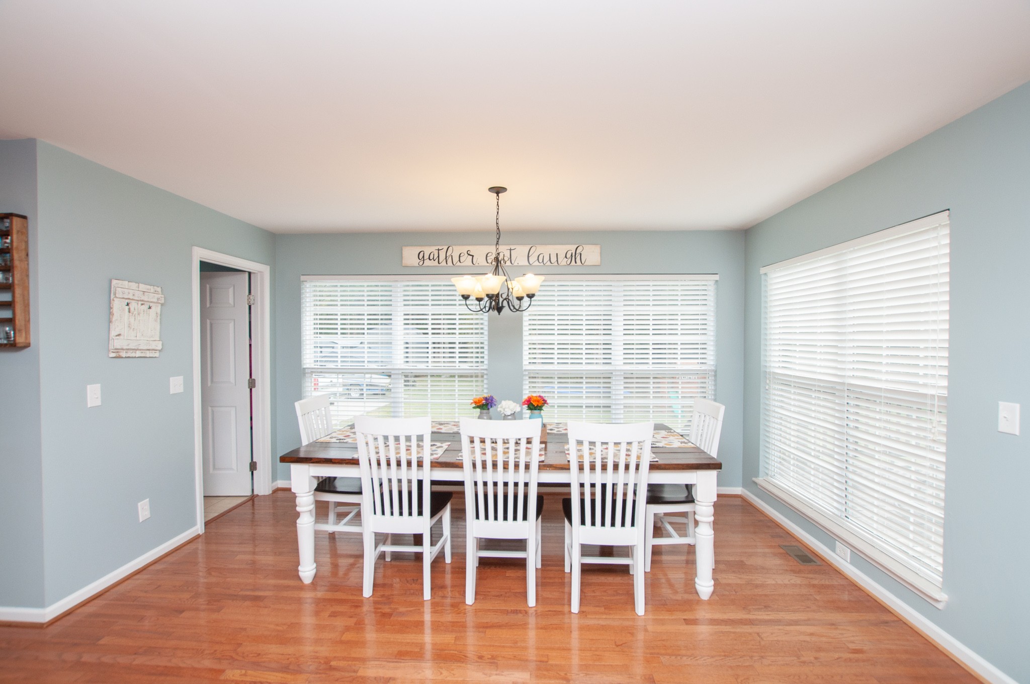 596 Windy Road Mount Juliet, TN 37122 - Photo 19 of 34 a view of a dining room with furniture and wooden floor