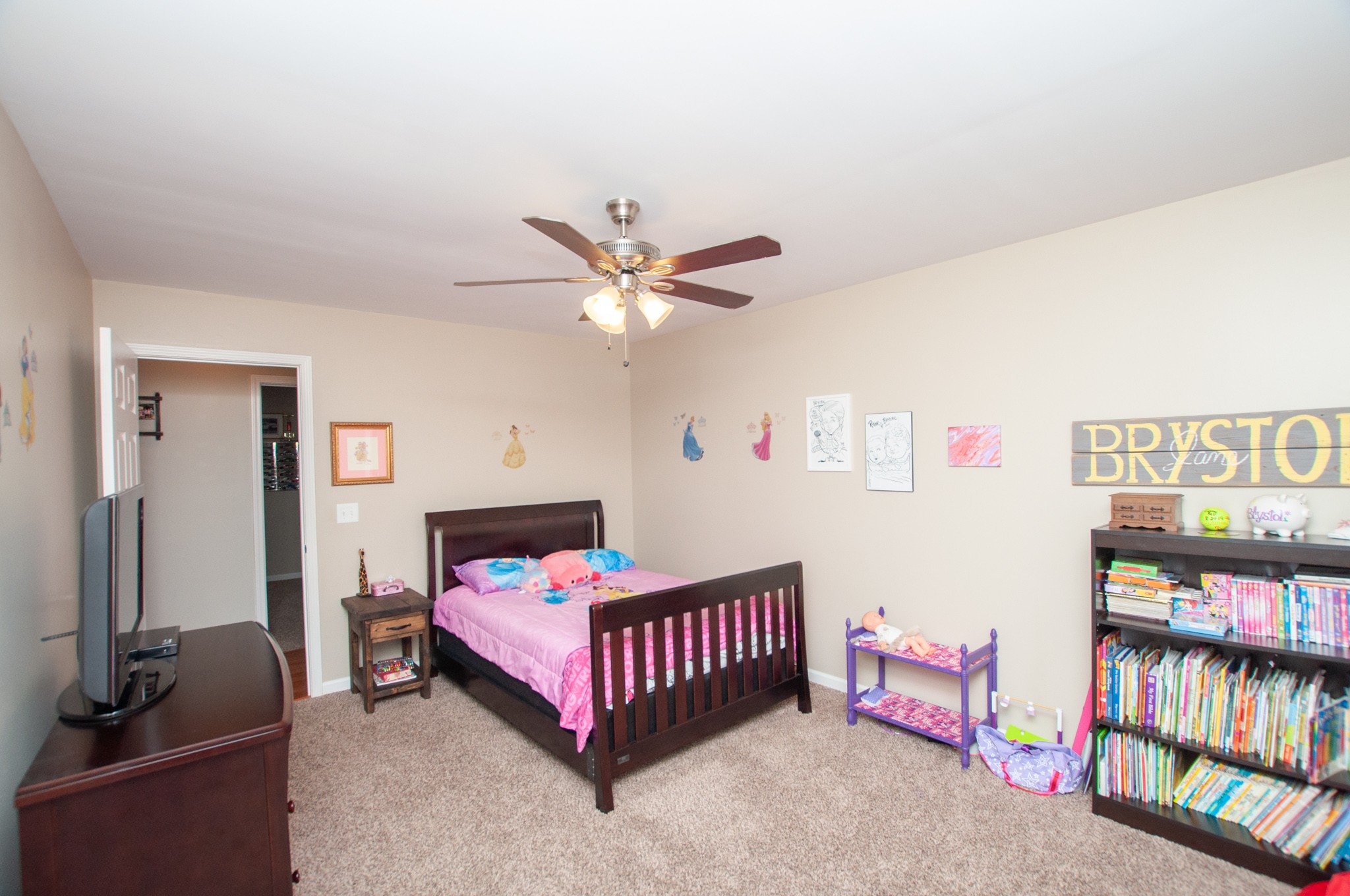 596 Windy Road Mount Juliet, TN 37122 - Photo 21 of 34 a bedroom with bed and a chandelier