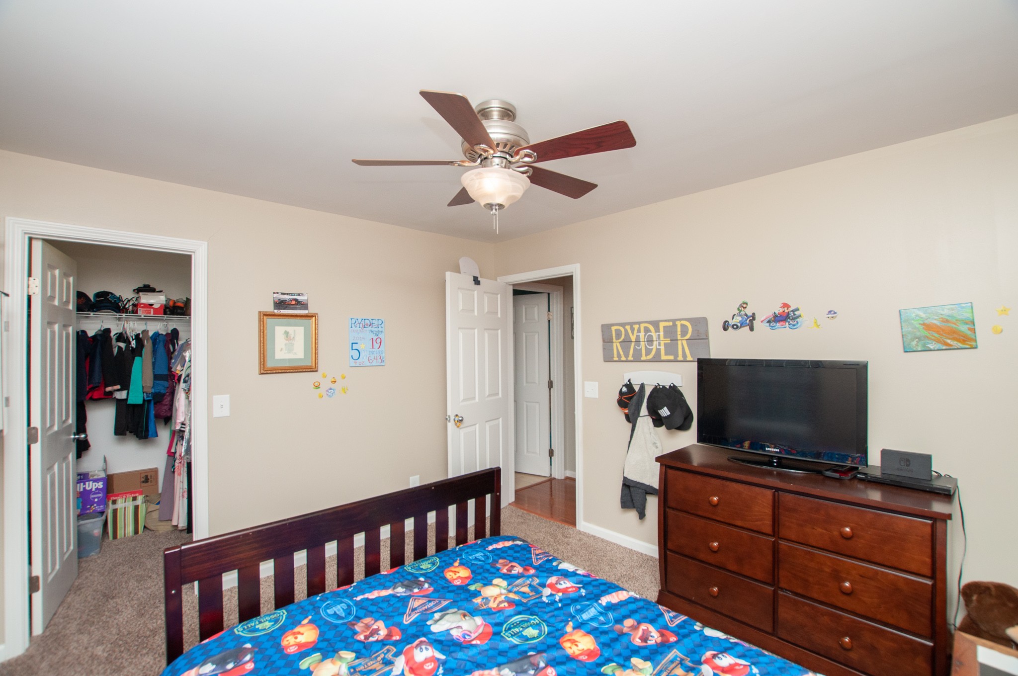 596 Windy Road Mount Juliet, TN 37122 - Photo 24 of 34 a bedroom with furniture and a flat screen tv