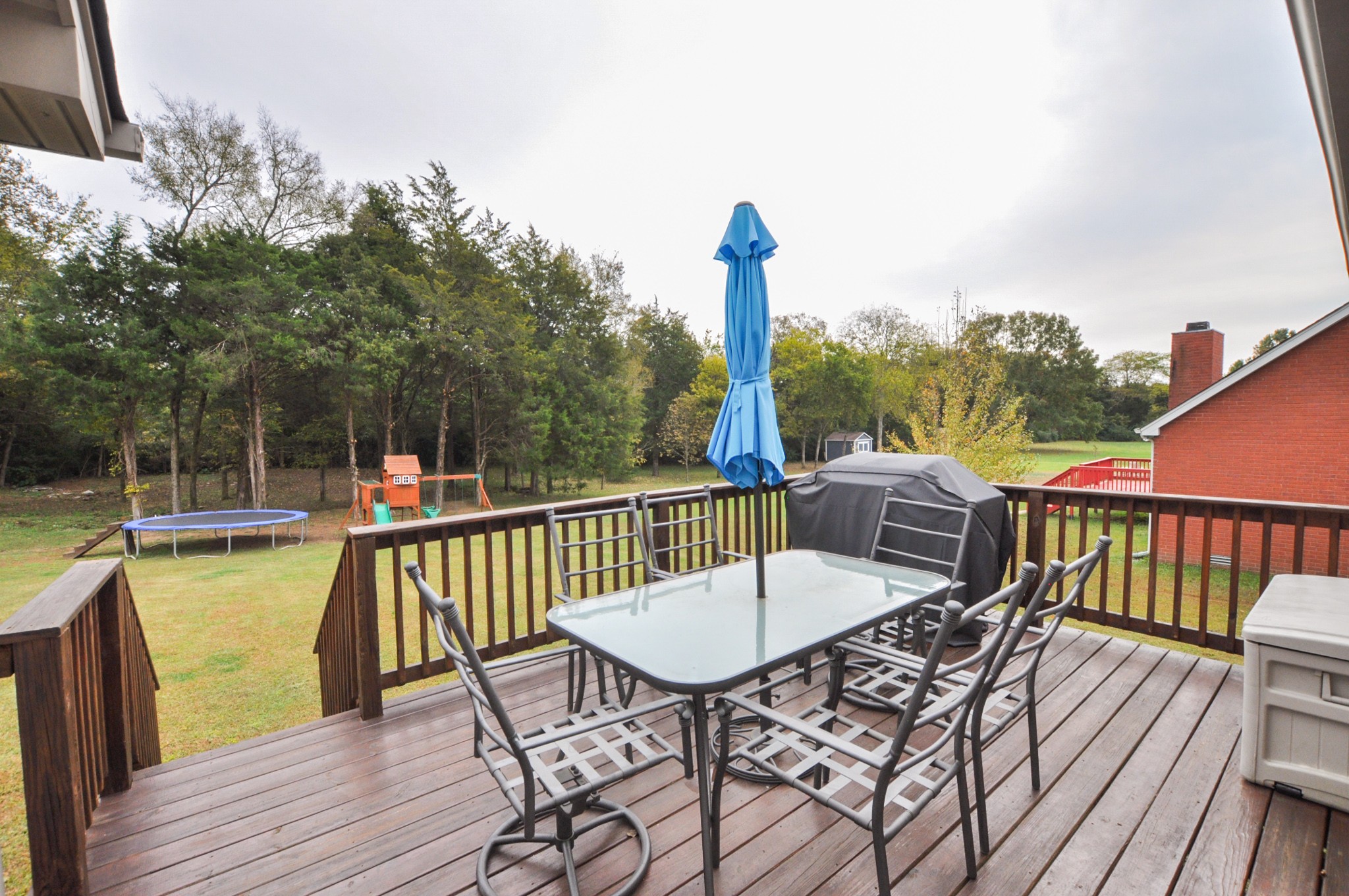 596 Windy Road Mount Juliet, TN 37122 - Photo 30 of 34 a view of a balcony with a table and chairs