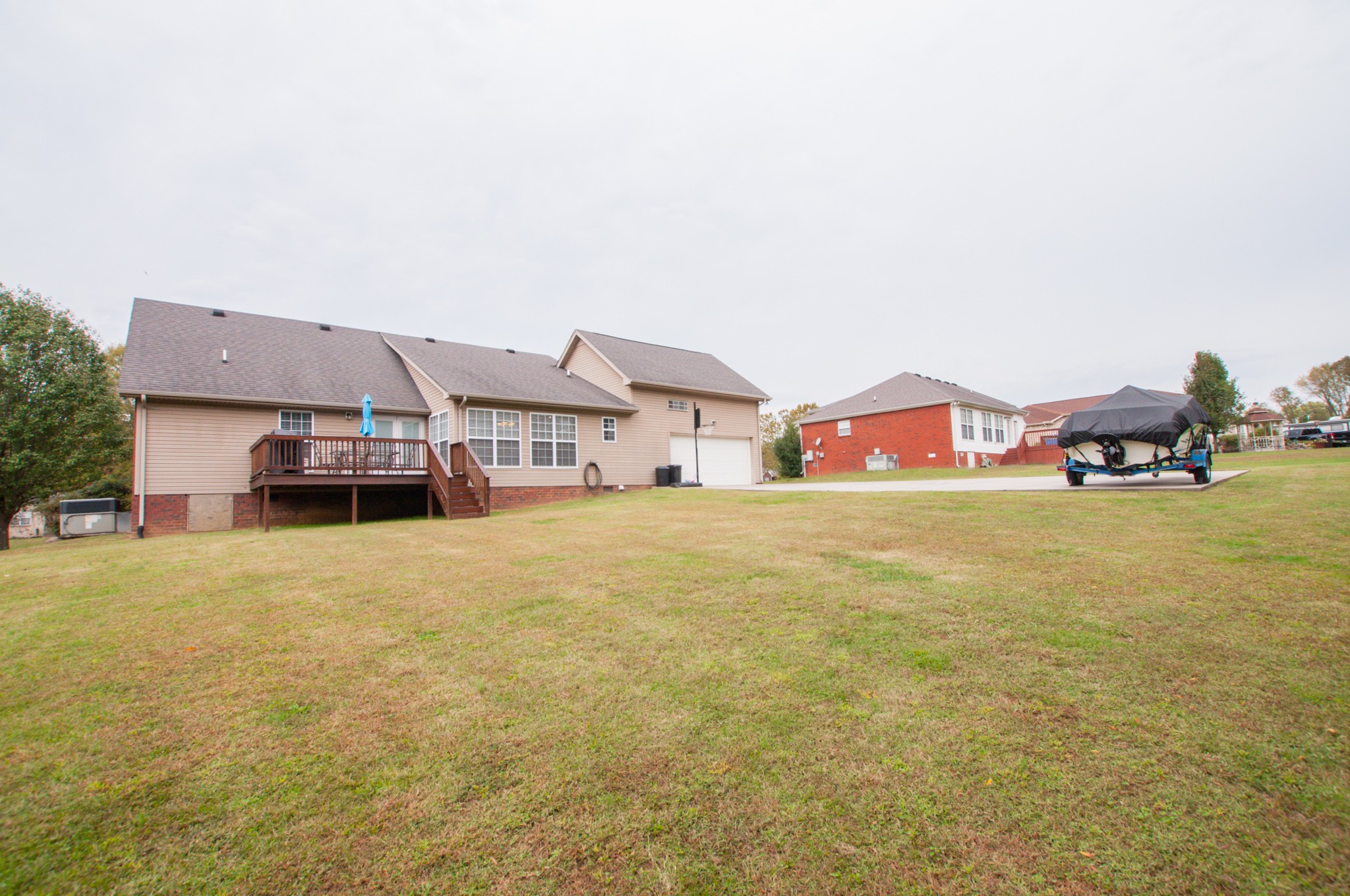 596 Windy Road Mount Juliet, TN 37122 - Photo 33 of 34 a front view of a house with large garden and parking space