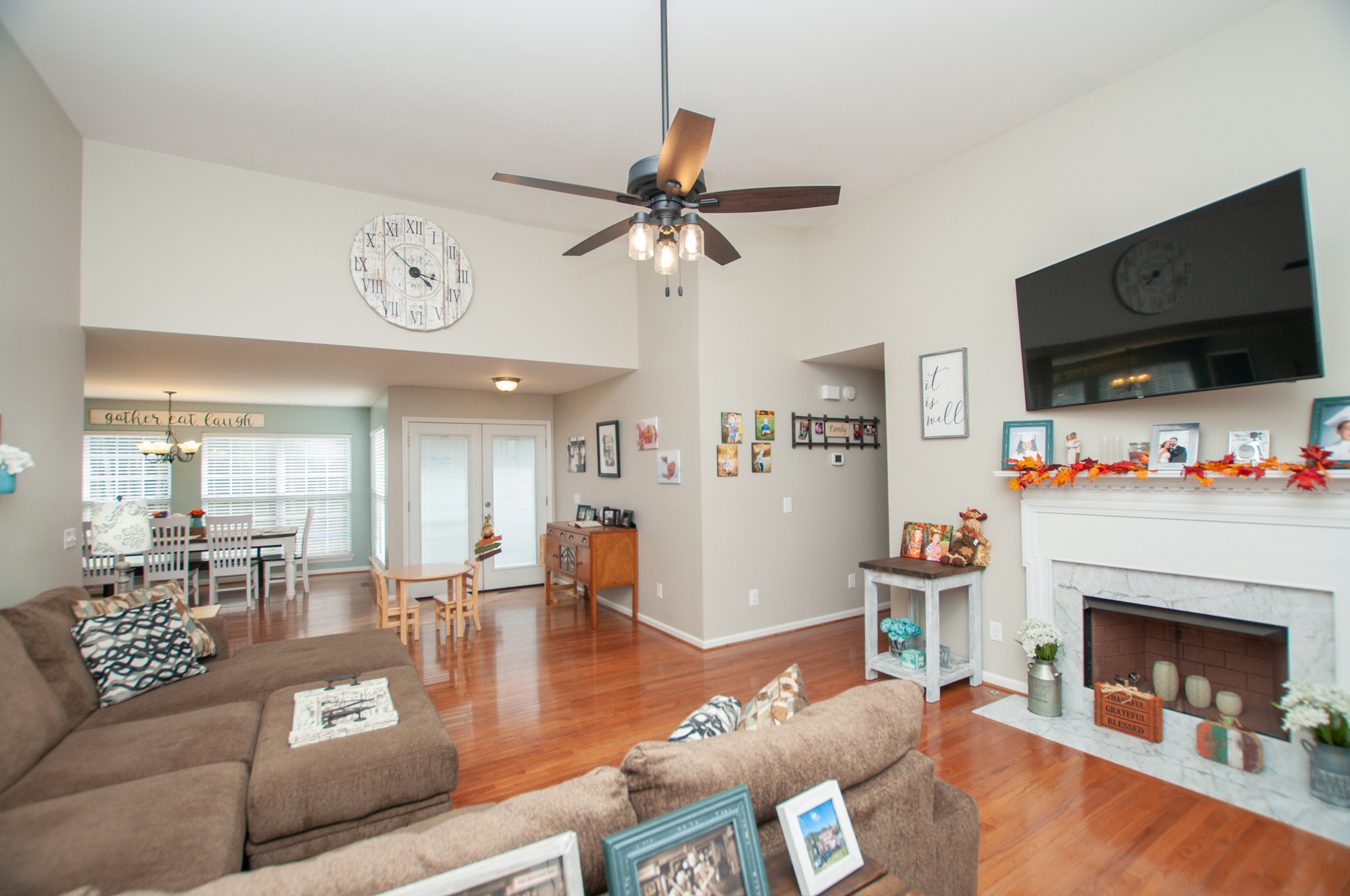 596 Windy Road Mount Juliet, TN 37122 - Photo 5 of 34 a living room with furniture fireplace and flat screen tv