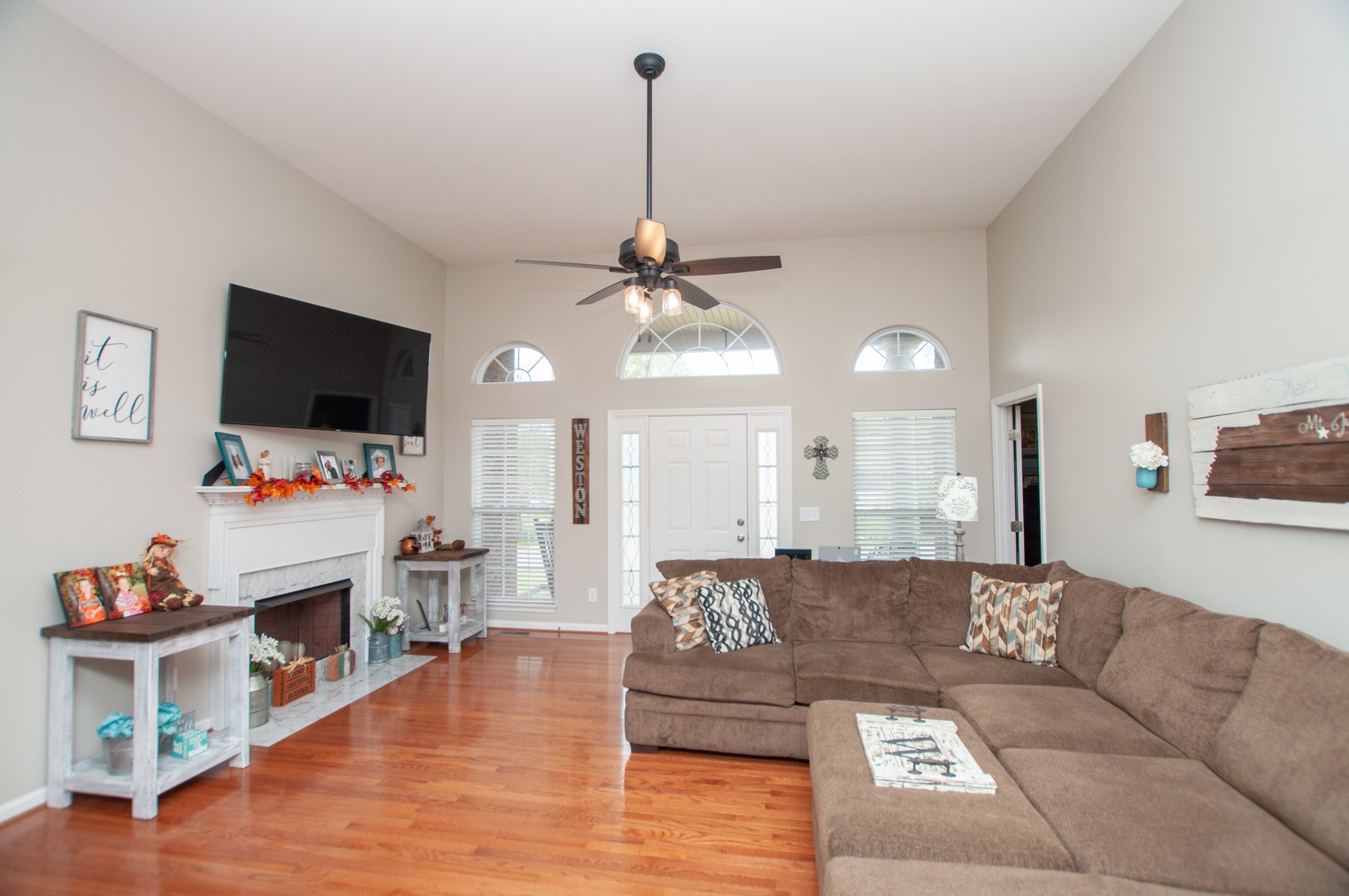 596 Windy Road Mount Juliet, TN 37122 - Photo 7 of 34 a living room with fireplace furniture and a flat screen tv