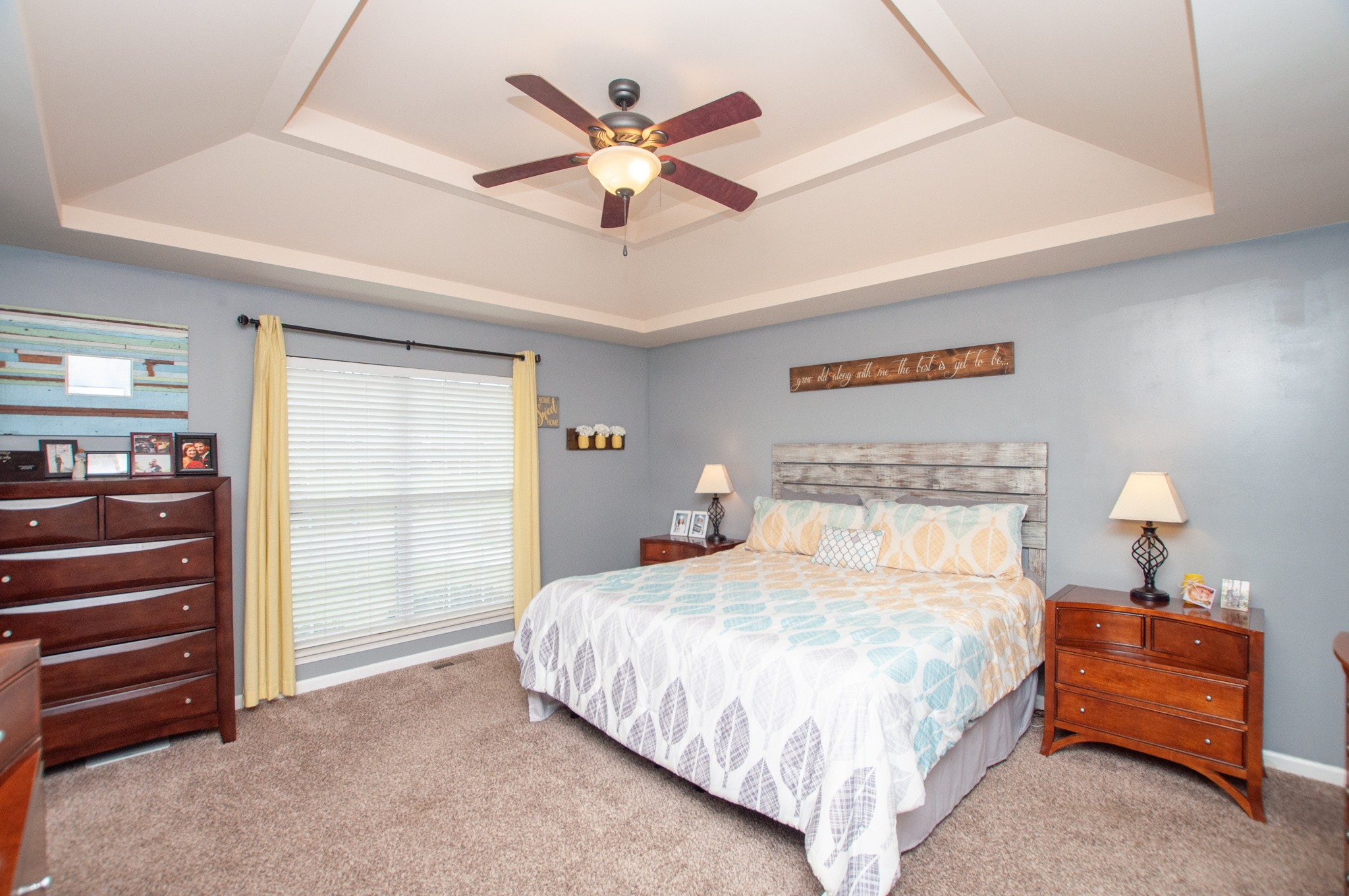 596 Windy Road Mount Juliet, TN 37122 - Photo 9 of 34 a bedroom with a bed and a ceiling fan