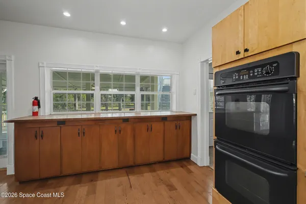 a kitchen with stainless steel appliances granite countertop a stove and a refrigerator