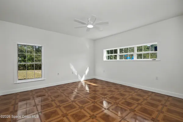 a view of an empty room with a window