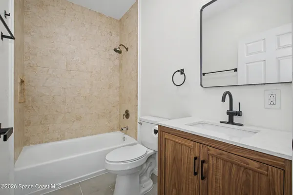 a bathroom with a sink a toilet and a bathtub
