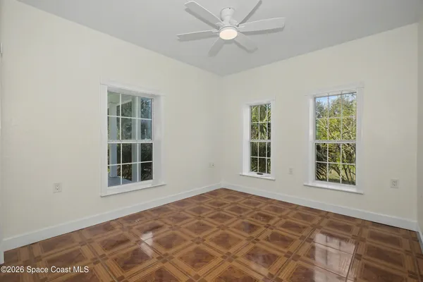 a view of an empty room with a window