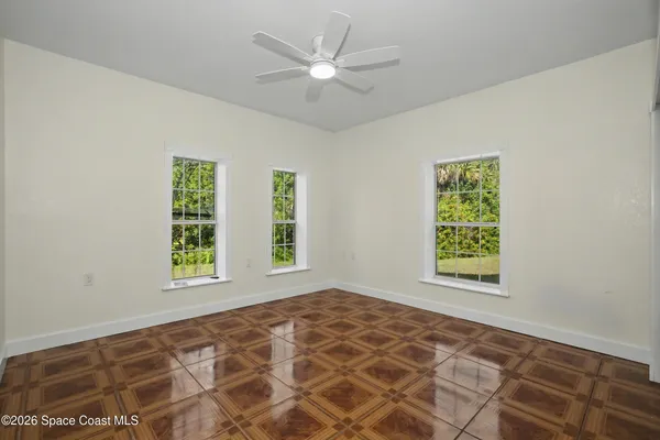 a view of an empty room with a window