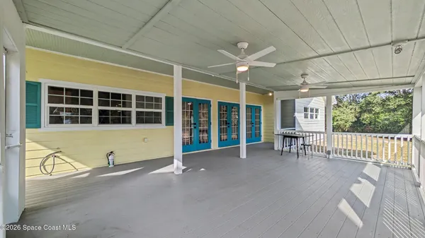 a view of an empty room with a balcony
