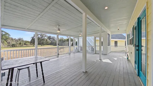a view of a porch with wooden floor and outdoor space