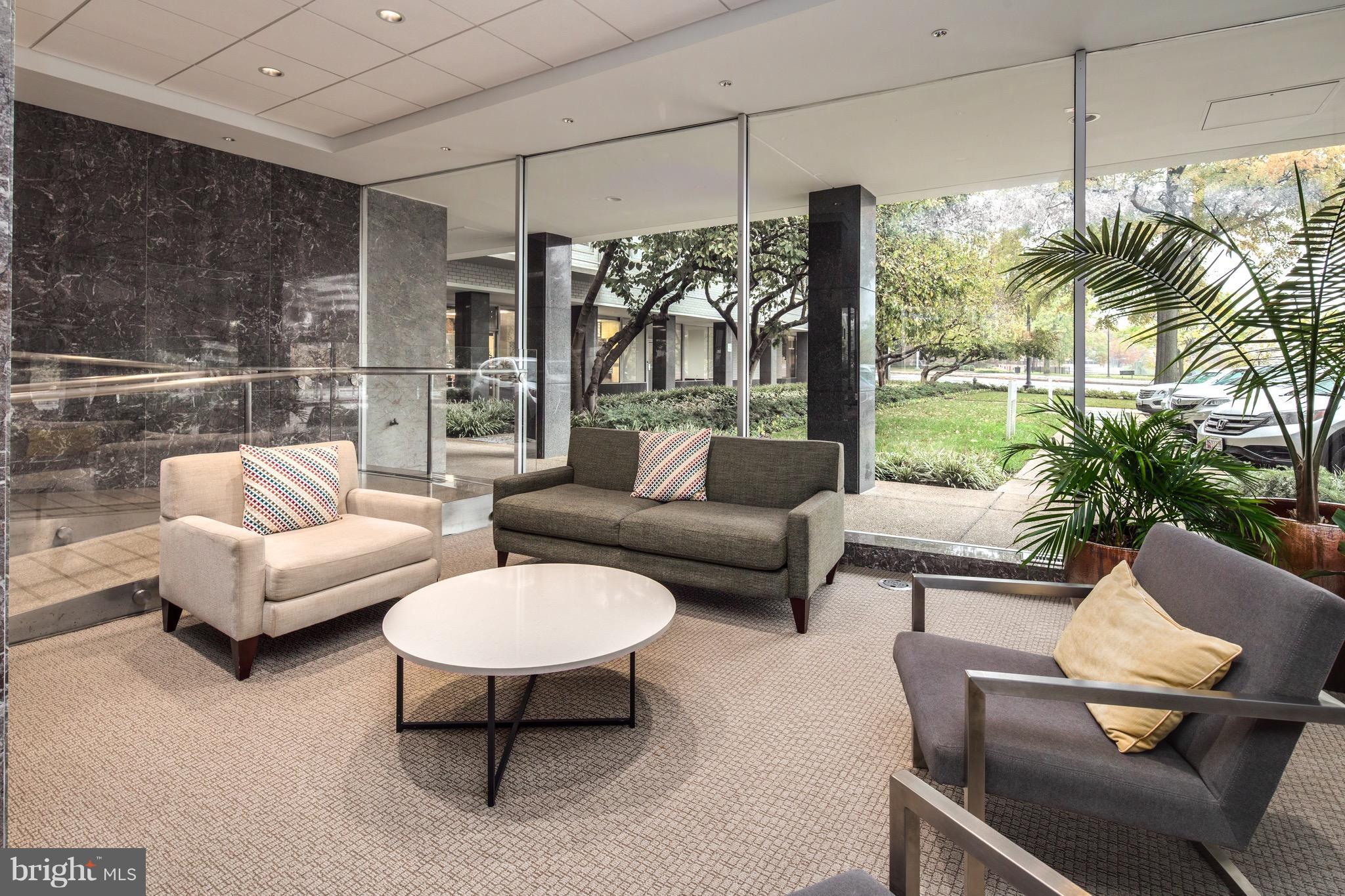 2475 Virginia Avenue Northwest, Unit 103 Washington, DC 20037 - Photo 14 of 16 a living room with furniture and a large window