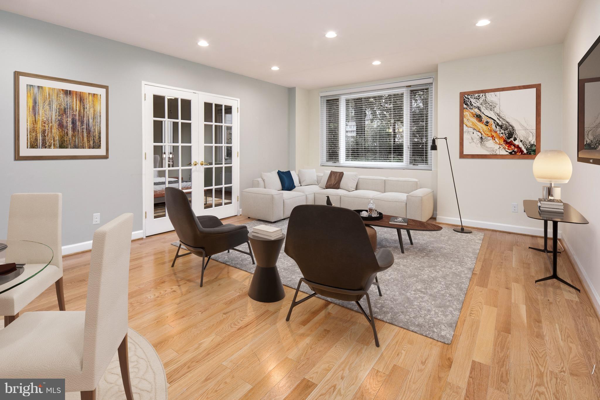 2475 Virginia Avenue Northwest, Unit 103 Washington, DC 20037 - Photo 3 of 16 a living room with furniture and a window