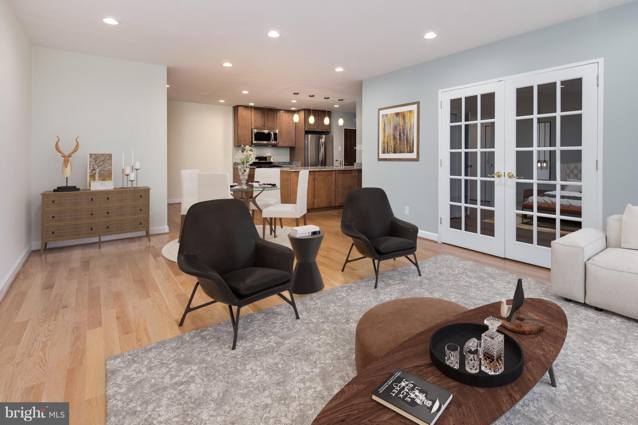 2475 Virginia Avenue Northwest, Unit 103 Washington, DC 20037 - Photo 4 of 16 a living room with furniture and a window