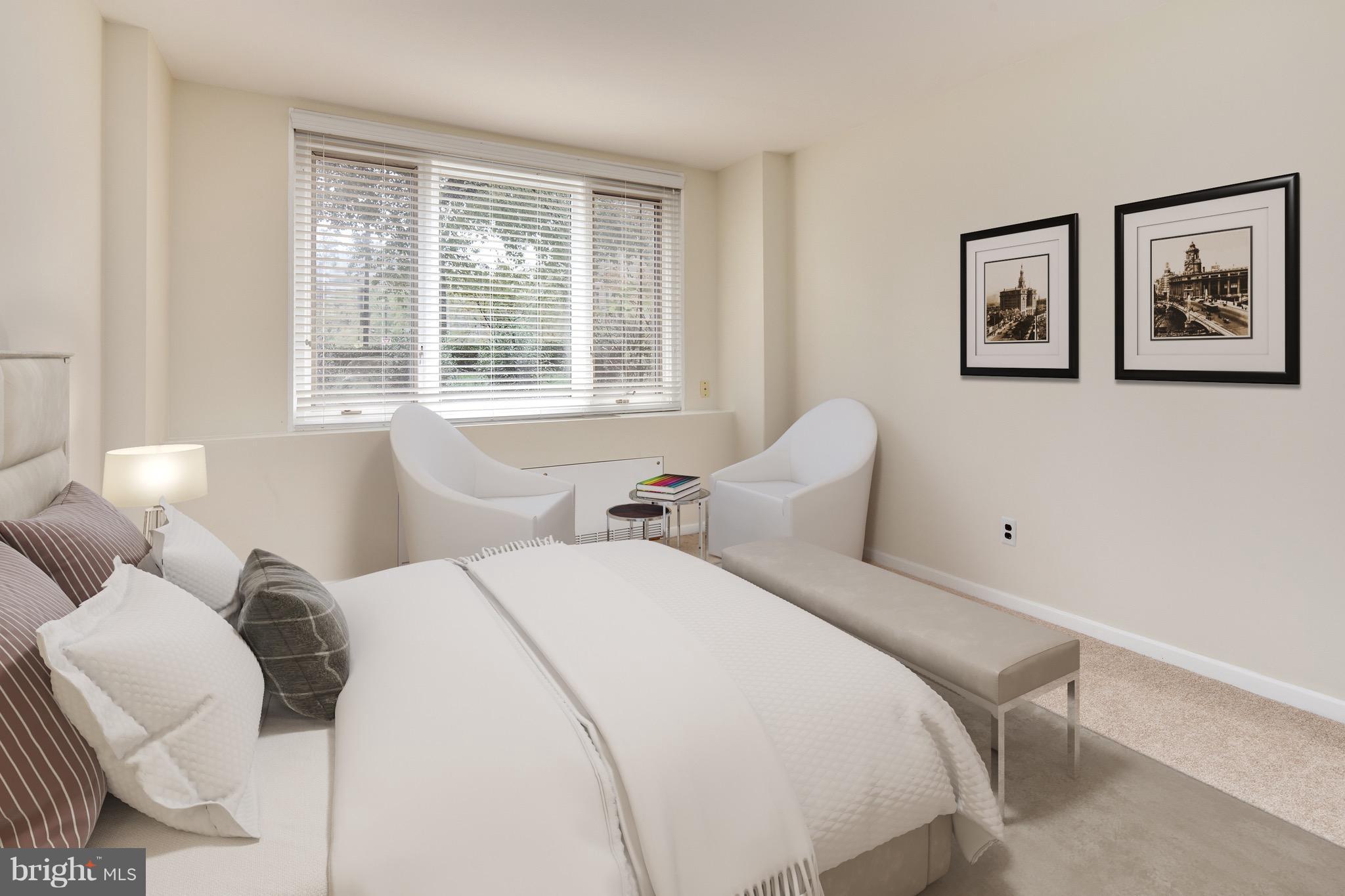 2475 Virginia Avenue Northwest, Unit 103 Washington, DC 20037 - Photo 8 of 16 a bed room with two bed and a large window