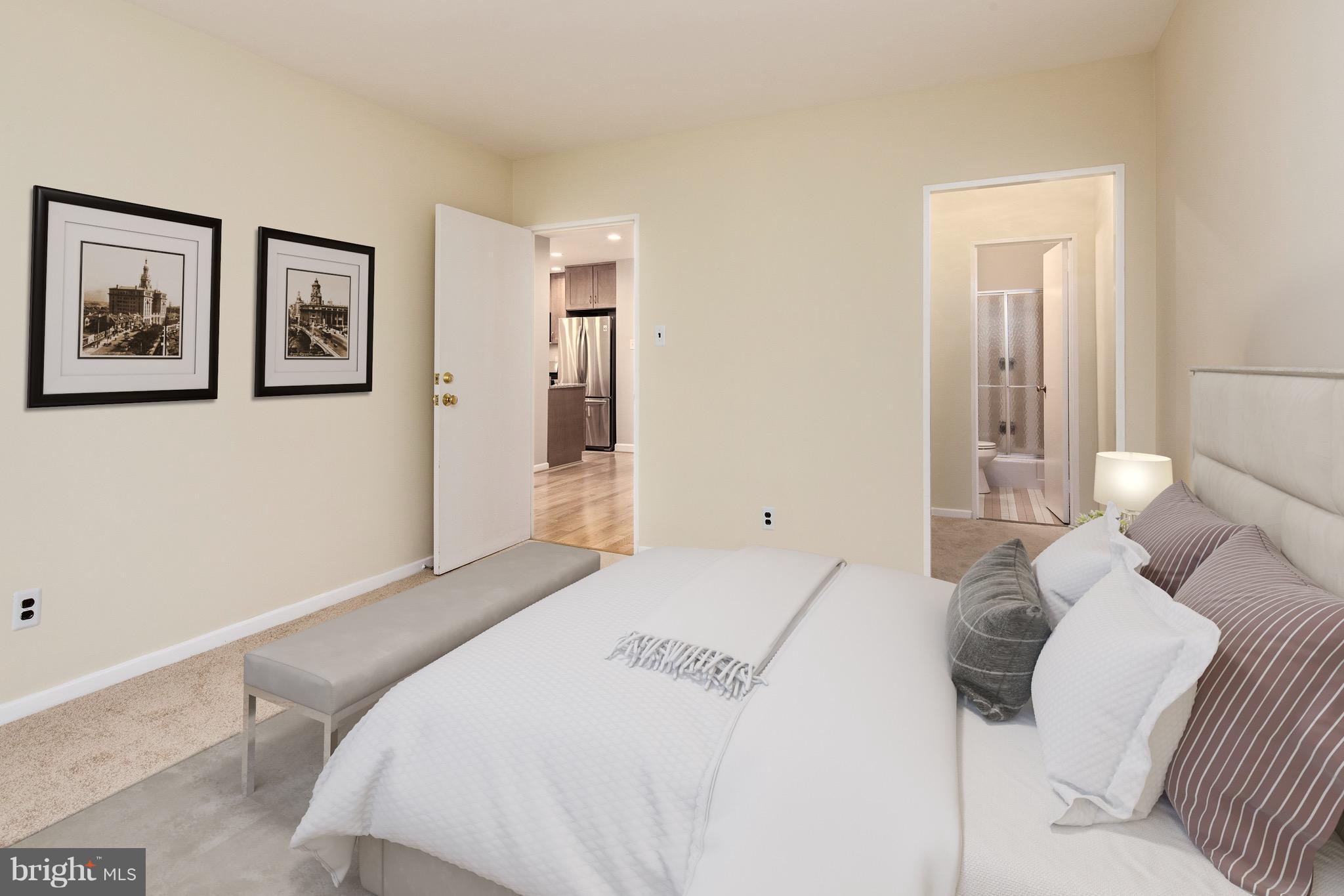 2475 Virginia Avenue Northwest, Unit 103 Washington, DC 20037 - Photo 9 of 16 a bedroom with a bed and the wall painting