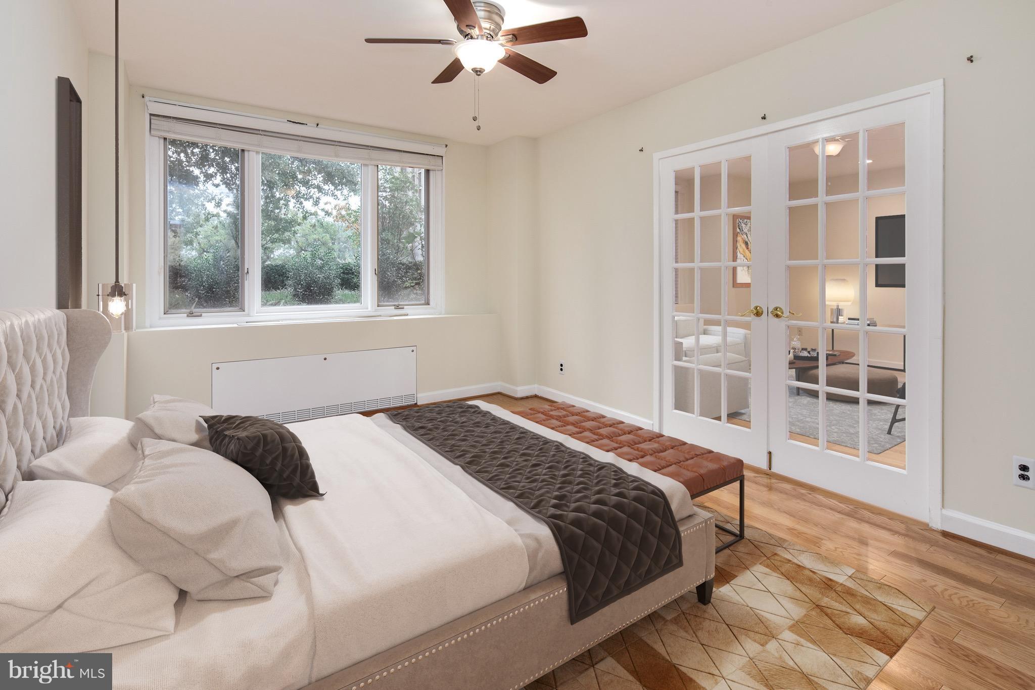2475 Virginia Avenue Northwest, Unit 103 Washington, DC 20037 - Photo 10 of 16 a bedroom with a large bed and a window