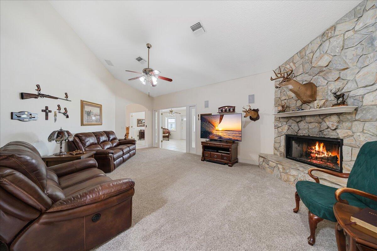3125 Davis Road Mims, FL 32754 - Photo 15 of 46 a living room with furniture and a fireplace