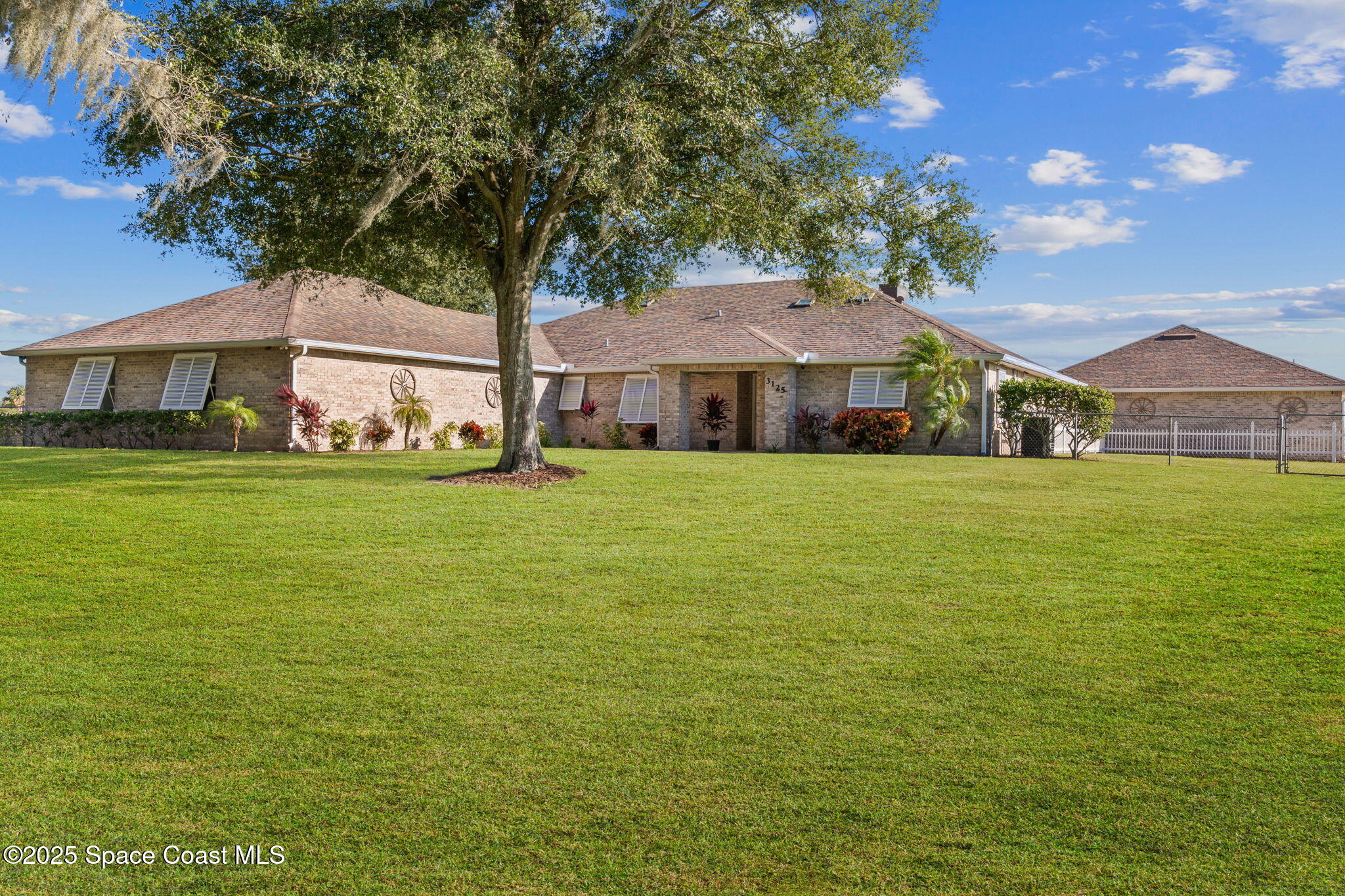 3125 Davis Road Mims, FL 32754 - Photo 2 of 46 a front view of a house with a yard