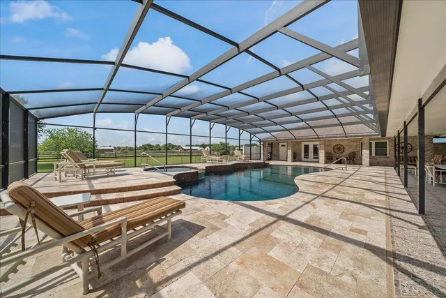 a view of a swimming pool with a patio